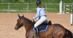 woman riding horse. developing focus