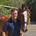 Alistair McLean from the Australian Equine Behaviour Centre with the Standardbred Ideal Guy